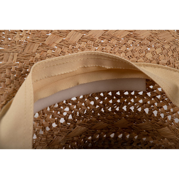Inside view of a straw hat showing foam hat filler for snug fit.